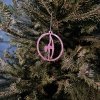 Close-up of the shining Pink Glitter Pole Dance Ornament on a tree branch